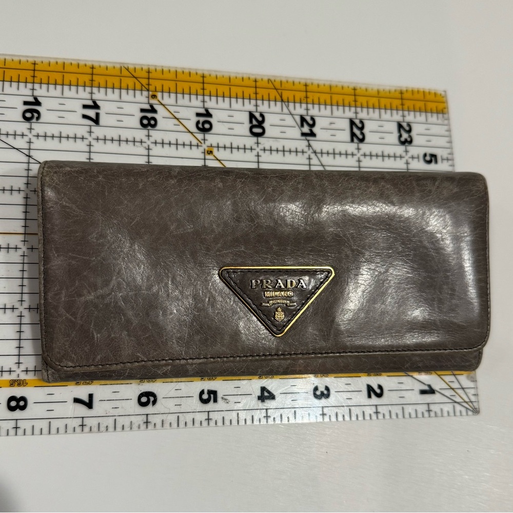 Prada distressed leather long wallet